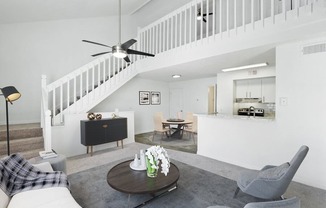 Model living room with staircase to 2nd level