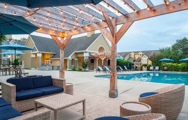 under the cabana looking out at dusk with outdoor lights lit