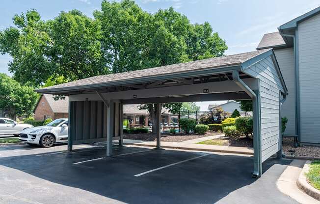 Carport with white car parked at Springhill Apartments, Overland Park, KS, 66213