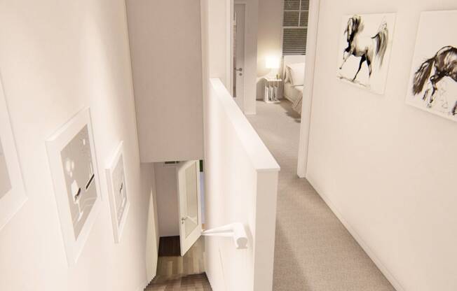 a hallway with white walls and pictures on the wall at Brownstones at Palisade Park Townhomes, Broomfield Colorado