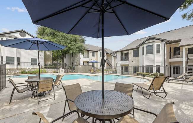 our apartments have a resort style pool and patio with umbrellas