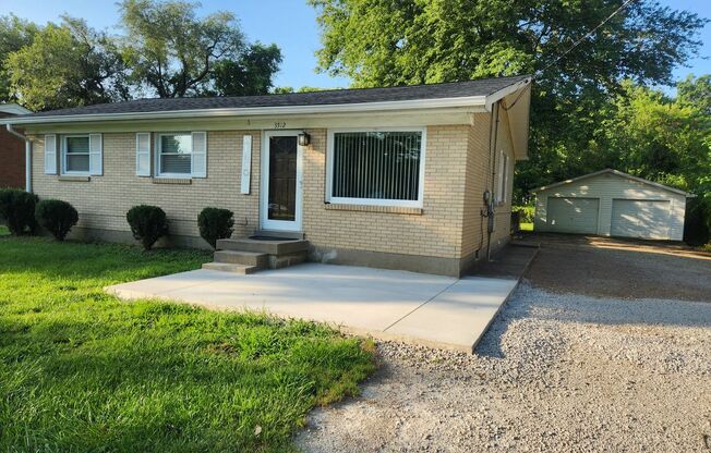 Beautiful and spacious 3 bedroom 1 bath home with large detached garage and updates!