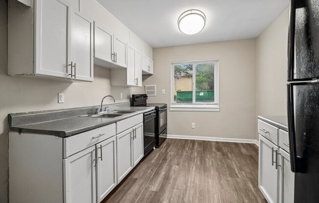 Step into modern living at The Preserve On Conley Apartments. This bright kitchen features sleek cabinetry, stainless steel appliances, and ample counter space, perfect for culinary enthusiasts. Elevate your lifestyle today—schedule a tour!