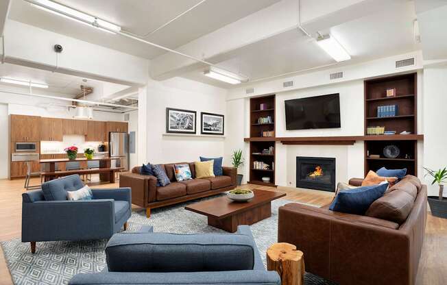 A living room with a fireplace and a television.