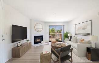a living room with white walls and a white couch with a wooden coffee table and black chair