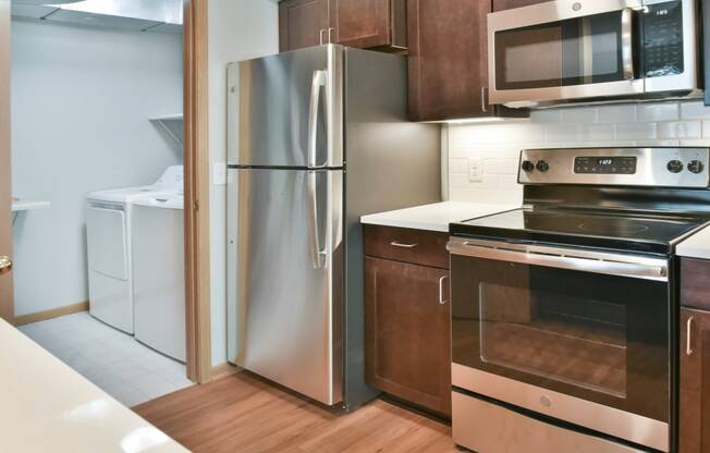 1 bedroom kitchen and laundry room with full size washer and dryer