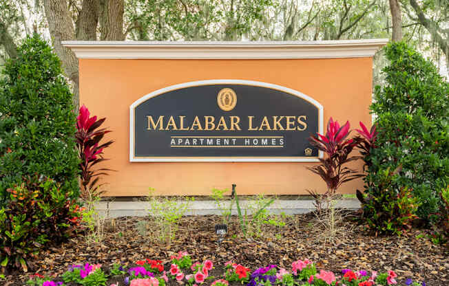 a sign for malabar lakes apartment homes