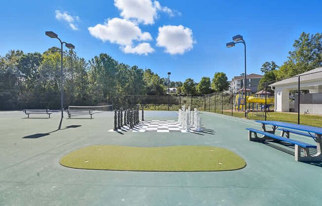 A park with a playground and benches.