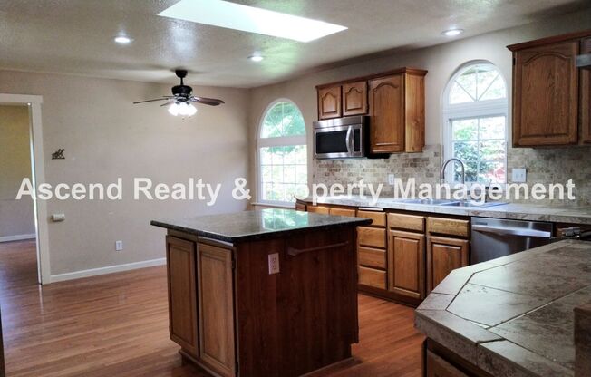 Spacious One Level Open Floor Plan with Large Kitchen, Central AC, Oversize Deck & Garden Containers Corner Lot