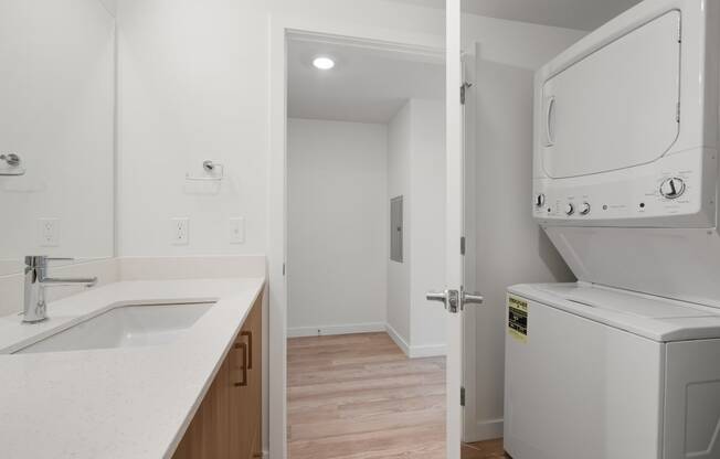 The Warren Apartments bathroom with washer and dryer