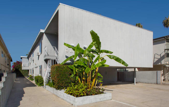 Exterior view of an apartment building with carport parking