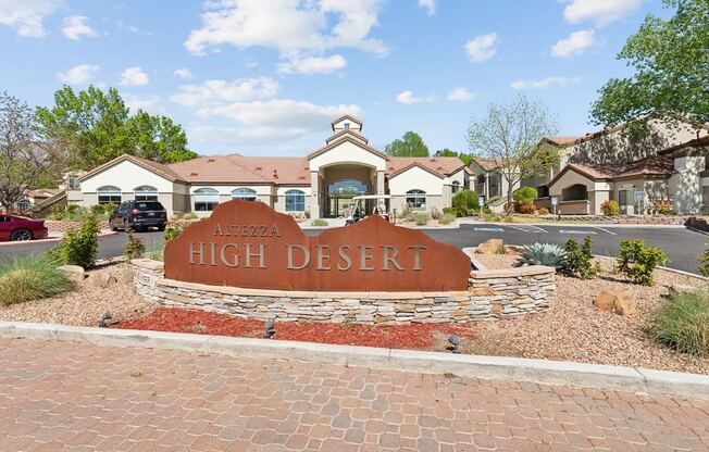 a sign for high desert in front of a building