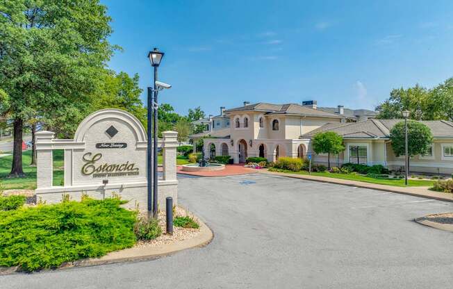 The entrance to the Estrada residential complex is marked by a large sign.