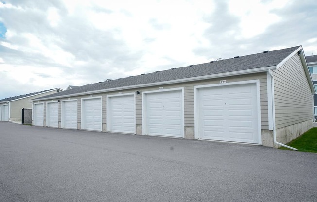 A long building with many garage doors.