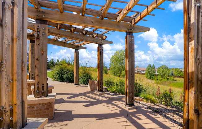 a covered walkway with a wooden structure