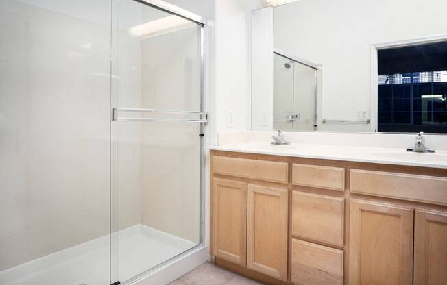 San Jose, CA Apartments for Rent - Aviara Apartments Bathroom with Wooden Cabinetry, Shower, and Bathtub