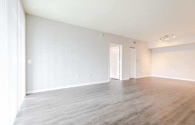 a bedroom with hardwood flooring at the oxford at estonia apartments in san an at Heritage Bay, Florida, 34957