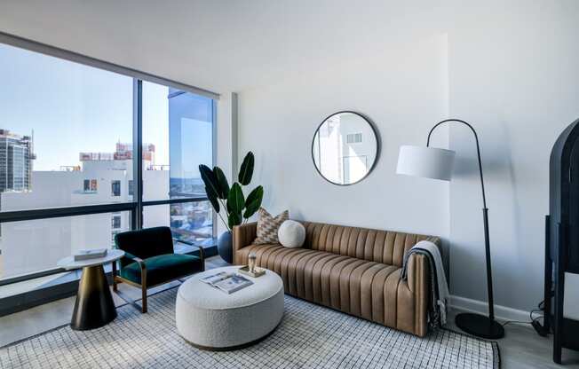 a living room with a couch and a large window
