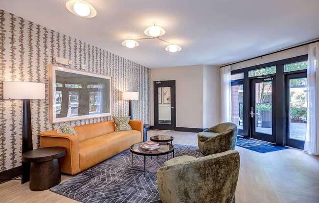 A lounge with a couch, chair, and coffee table.