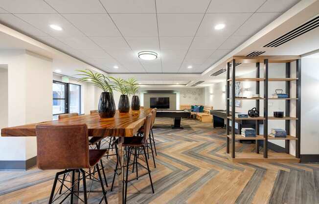 A conference room with a long table and chairs.
