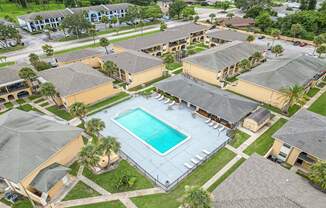 a birds eye view of the resort style pool at the village apartments