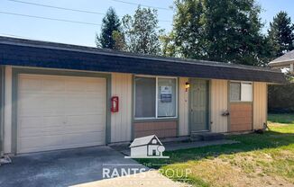 Spacious 2-Bedroom Duplex Unit with a Garage and Fenced Backyard