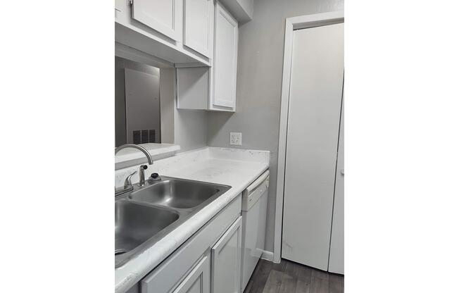 a kitchen with a stove and a sink