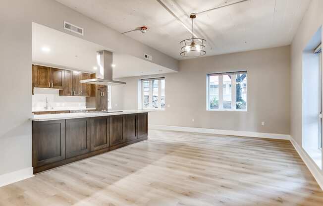 A spacious kitchen with wooden floors and a large island.