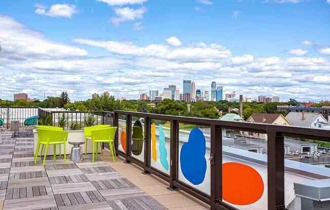 A patio with a view of the city skyline.