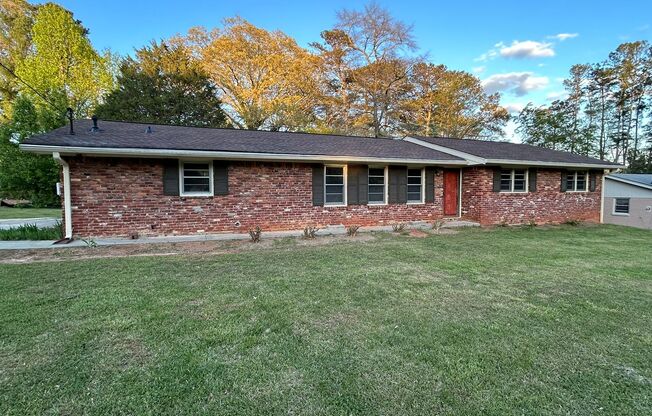 JUST LIKE NEW! Landlord just finishing up doing a total remodel on this 3 bedroom/2 bath home with large outbuilding.
