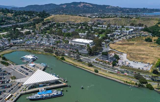 A boat is docked at a pier in a harbor.