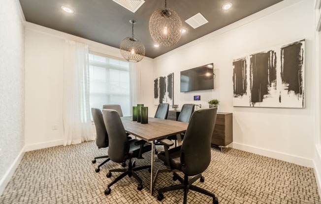 an image of a conference room with a table and chairs