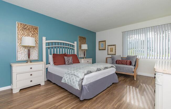 a bedroom with a bed in a room