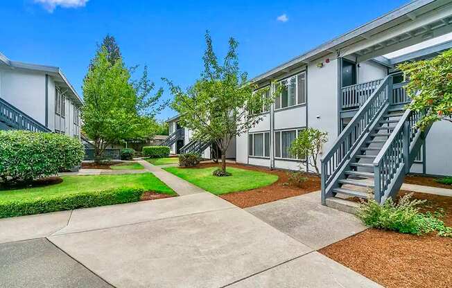A sunny day at a residential complex with a clear blue sky.