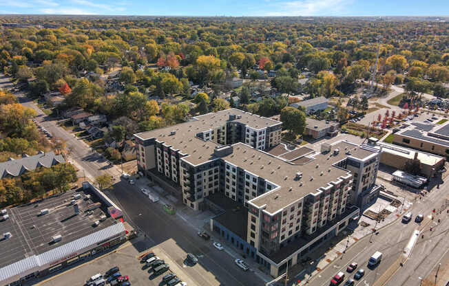 A large building with a parking lot in front of it.