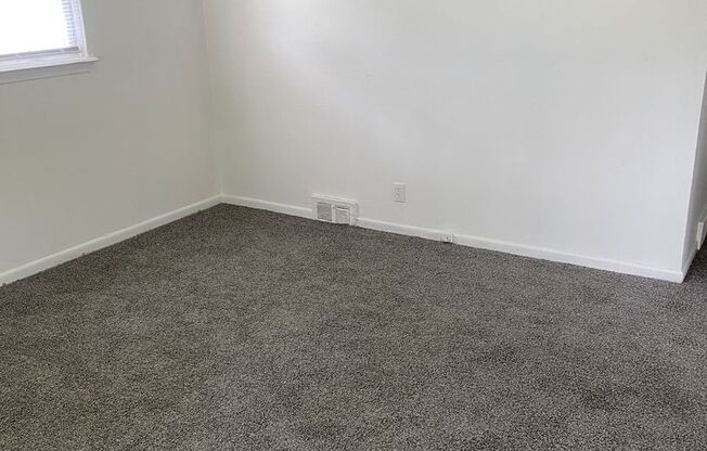 Freshly painted 3 bedroom, 1 1/2bath ranch with basement and garage