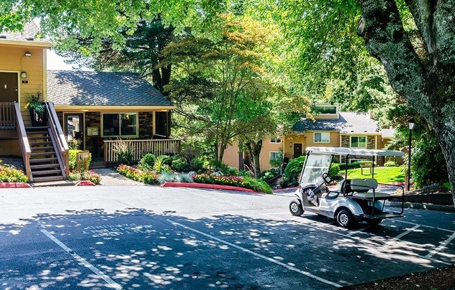 a golf cart parked in front of a house  at The Bluffs at Mountain Park, Lake Oswego, OR