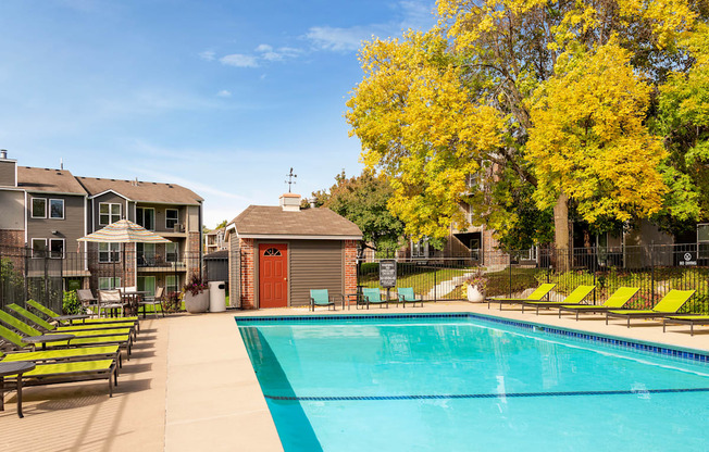 Outdoor pool with lounge chairs at Eden Commons in Eden Prairie, MN 55344