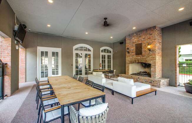A large dining room with a long table and chairs.