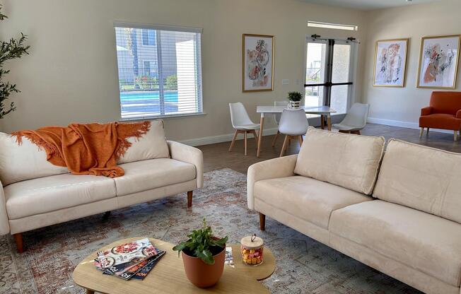 a living room filled with furniture and a flat screen tv