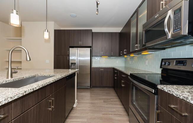 a modern kitchen with stainless steel appliances