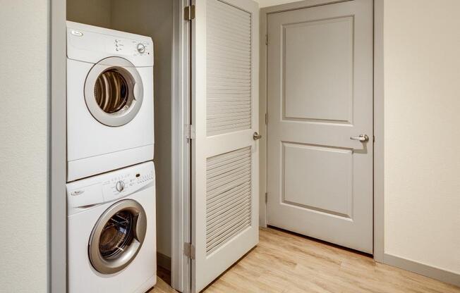 a washer and dryer in a room with a door