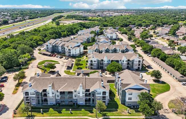 an aerial view of a neighborhood with houses and trees