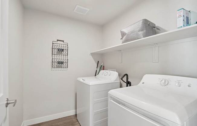 A laundry room with a washer and dryer.