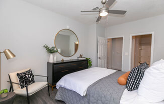 a bedroom with a bed and a ceiling fan at Deerfield Village, Alpharetta