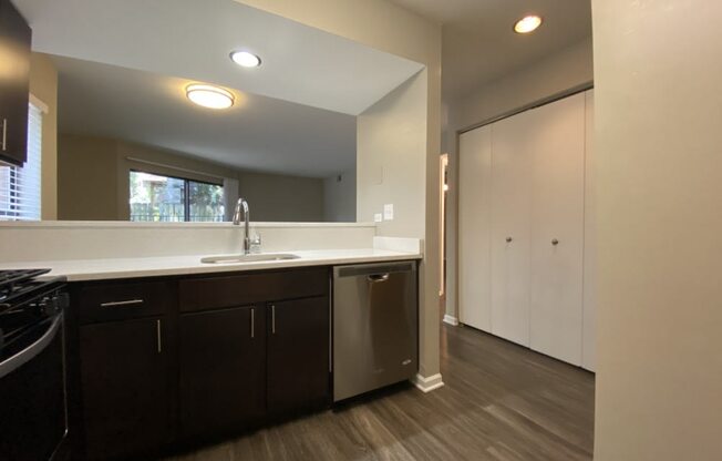 Spacious kitchen with rich flooring