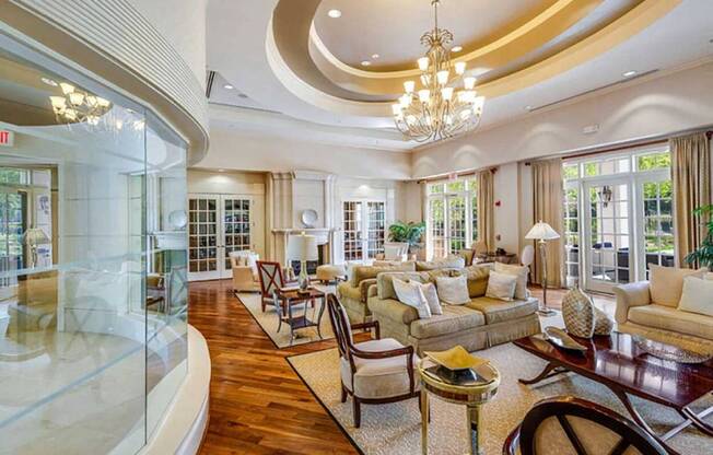 a living room filled with furniture and a glass door