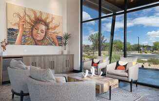 A living room with a large painting of a woman with sun in her hair.