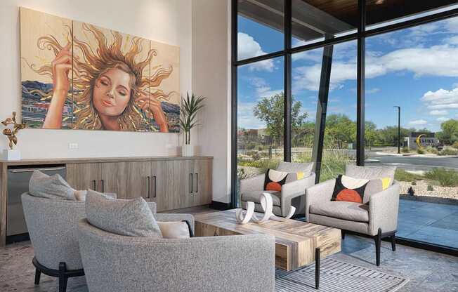 A living room with a large painting of a woman with sun in her hair.