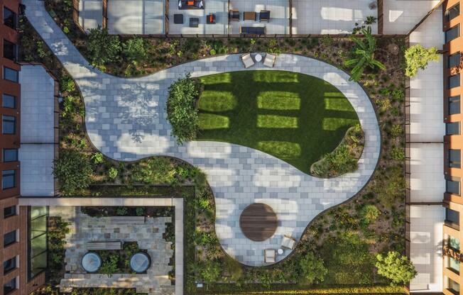 Unwind in the serene garden oasis of Mabel, where modern design meets lush greenery. Enjoy thoughtfully crafted spaces for relaxation and recreation. Schedule a visit today to see the beauty for yourself and find your perfect retreat!